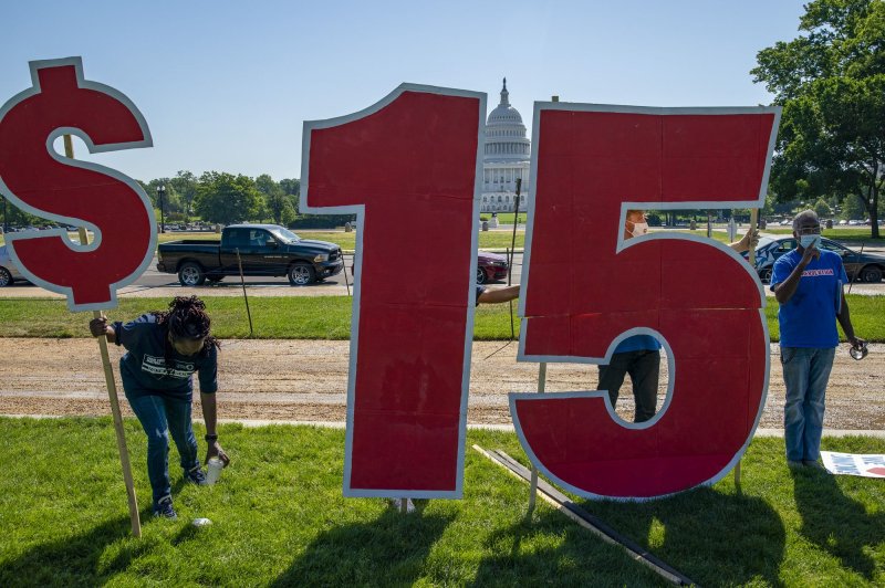 Service Employee International Union members demonstrate for a $15 per hour minimum wage during a rally outside the U.S. Capitol in Washington, D.C., on May 19. File photo by Tasos Katopodis/UPI