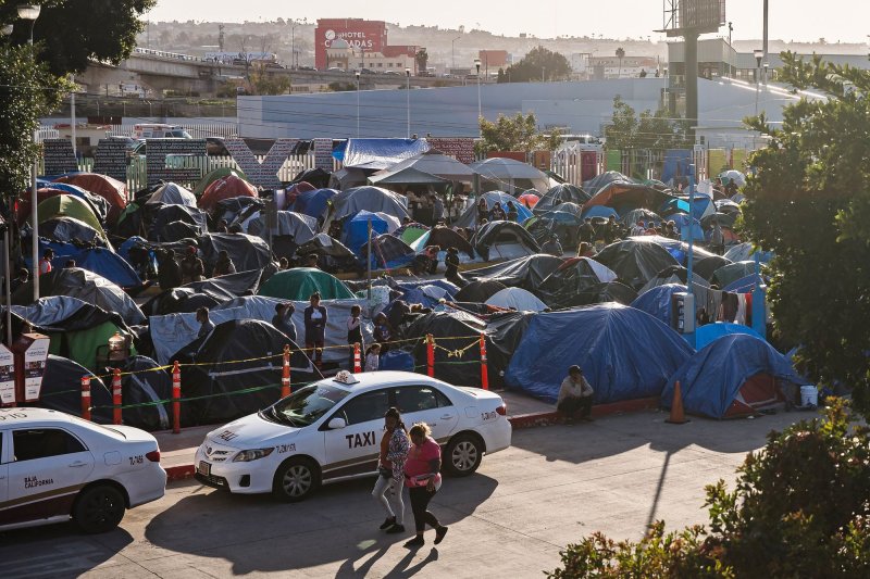 Hundreds of asylum seekers set up tents by the port of entry at El Chaparral plaza in Tijuana, Mexico, on March 26, 2021. File Photo by Ariana Drehsler/UPI | <a href="/News_Photos/lp/7001f256515a783f76341b3fd1947204/" target="_blank">License Photo</a>