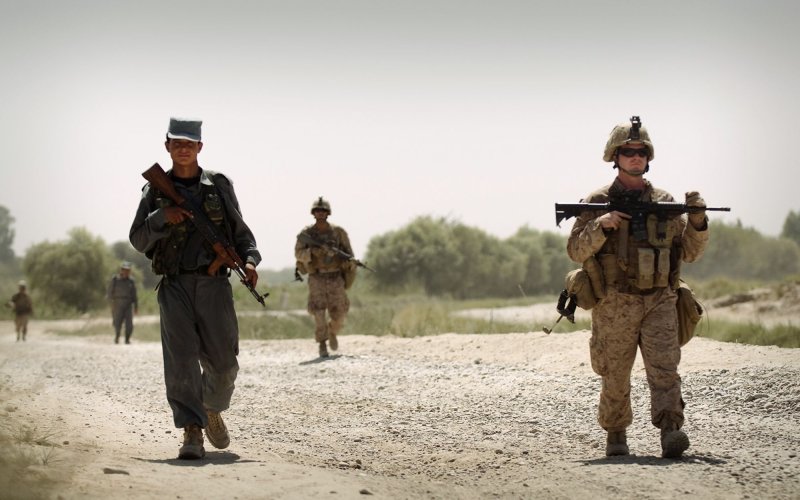 Sgt. Christopher Conaway (R), a squad leader with Kilo Company, 3rd Battalion, 3rd Marine Regiment, leads his squad and Afghan National Police officer partners on a brief patrol back to Patrol Base Jaker after manning a vehicle checkpoint as part of security for the Nawa District bazaar in Helmand province, Afghanistan on September 3, 2010. UPI/Mark Fayloga/U.S. Marines