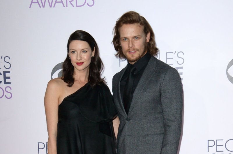 "Outlander" co-stars (L-R) Caitriona Balfe and Sam Heughan arrive for the 41st annual People's Choice Awards in Los Angeles on January 7, 2015. File Photo by Jim Ruymen/UPI | <a href="/News_Photos/lp/1ced8c6bd1975942386ef672ec6caf5b/" target="_blank">License Photo</a>