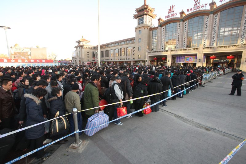 Thousands of Chinese make their way to one of Beijing's main train stations as they travel home ahead China's approaching Lunar New Year, the Year of the Rabbit, January 30, 2011. About 230 million Chinese are expected to take part in the world's biggest annual human migration ahead of the Spring Festival, China's most important holiday. UPI/Stephen Shaver