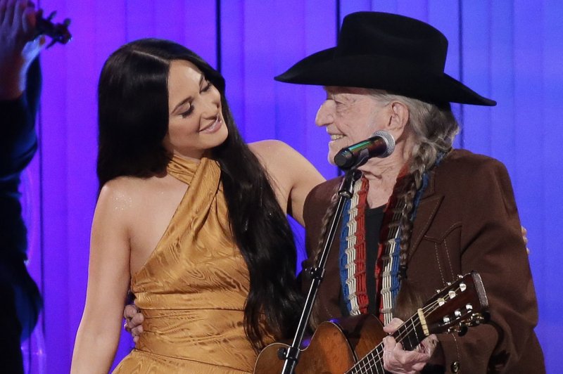 Willie Nelson performs with Kacey Musgraves at the 52nd Annual Country Music Association Awards on November 13, 2019. Nelson said he won't perform live until everyone is vaccinated. File Photo by John Angelillo/UPI