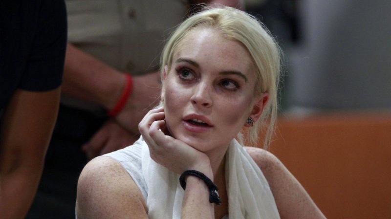 Actress Lindsay Lohan listens as a judge revokes her probation for failing to appear at a series of community service appointments at the Los Angeles Superior Court Airport Branch Courthouse during a progress report hearing in Los Angeles on October 19, 2011. UPI/Mark Boster/pool