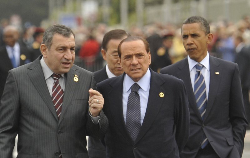 U.S. President Barack Obama (R) walks with U.N. Secretary General Ban Ki-moon behind former Italian Prime Minister Silvio Berlusconi to a lunch at the G8 Summit in Deauville, France, May 27, 2011. UPI