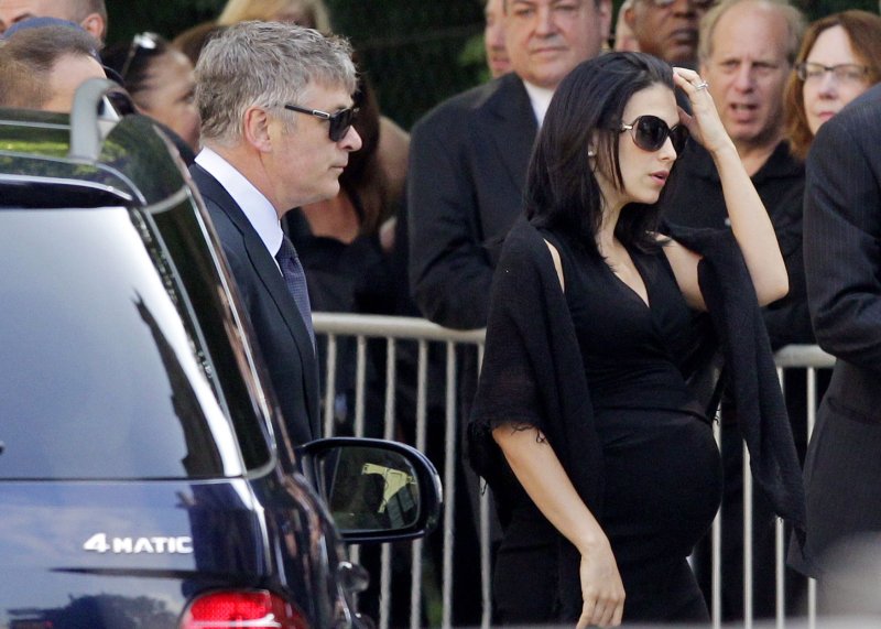Alec Baldwin and wife Hilaria Thomas arrive at the funeral for Actor James Gandolfini at the Cathedral of Saint John the Devine in New York City on June 27, 2013. Gandolfini rose to fame as crime boss Tony Soprano on the "The Sopranos". UPI/John Angelillo | <a href="/News_Photos/lp/c7db55ccf0b4f45ff0bab71fba8453cc/" target="_blank">License Photo</a>