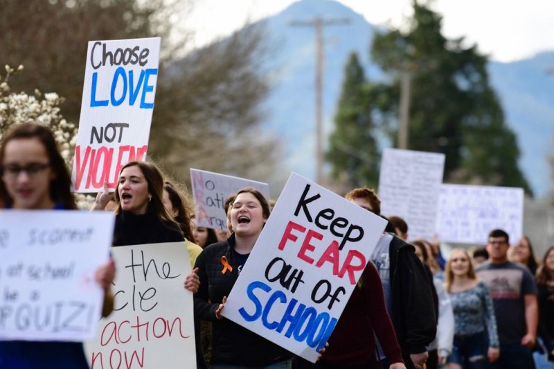 Grants Pass High School students participate a national walkout to honor Florida school shooting victims, in Grants Pass, Oregon, March 14, 2018. Photo by David Tulis/UPI | <a href="/News_Photos/lp/a61d5497b2f5a8181d0efcfa5a4146d0/" target="_blank">License Photo</a>