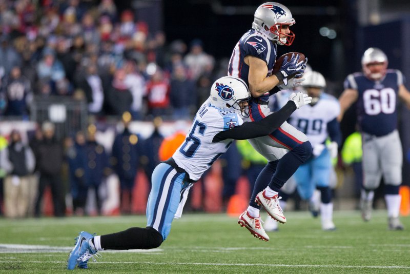 Former New England Patriots wide receiver Danny Amendola (80) is tackled by Tennessee Titans cornerback Logan Ryan (26) on a 15-yard reception in the first quarter of the AFC Divisional Round on January 13, 2018 at Gillette Stadium in Foxborough, Massachusetts. Photo by Matthew Healey/UPI