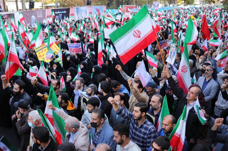 Pro-government supporters chant slogans and wave their national flags during a gathering out of the former U.S. embassy in Tehran, Iran, in November 2022, to mark the anniversary of the seizure of the U.S. embassy in 1979. File Photo by Iranian President press Office/UPI