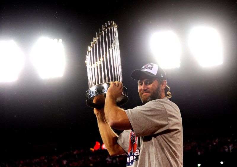 St. Louis Cardinals Lance Berkman, shown holding the Commissioner's Trophy after the Cardinals won the 2011 World Series last October, on Friday was placed on the 15-day disabled list because of a leg injury. UPI/Kevin Dietsch