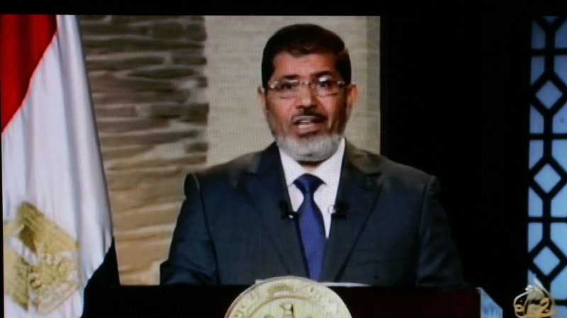 In this image taken from al-Jazeera TV, newly elected President Mohammed Morsi delivers a speech in Cairo, Egypt, Sunday, June 24, 2012. Morsi has called for unity and said he carries "a message of peace" to the world in his first televised speech on state TV. UPI