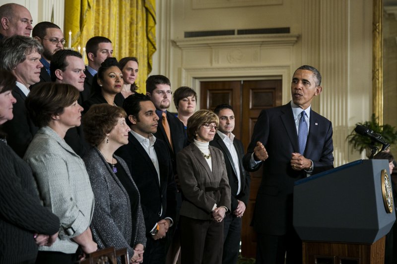 U.S. President Barack Obama speaks before signing a presidential memorandum increasing overtime protections for workers during an event in the East Room of the White House in Washington, DC on March 13, 2014. The memorandum instructs the Labor Secretary Tom Perez to update overtime regulations that will include increasing the number of workers eligible. UPI/T.J. Kirkpatrick/Pool
