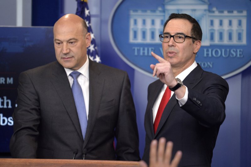 Treasury Secretary Steven Mnuchin (R) points to a questioner as White House chief economic adviser Gary Cohn listens as they roll out a tax reform plan during a briefing with the media Wednesday at the White House. Photo by Mike Theiler/UPI
