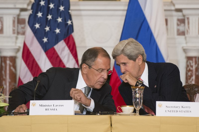 U.S. Secretary of State John Kerry (right) and Russian Foreign Minister Sergey Lavrov, pictured in 2013, spoke by phone on Nov. 12, 2014, regarding the status of Iranian nuclear negotiations. (UPI/Kevin Dietsch)
