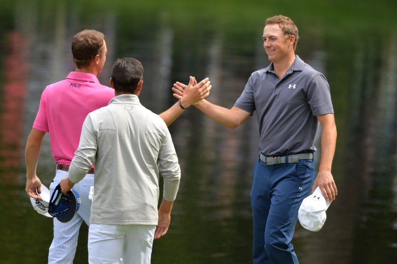 Jordan Spieth shakes hands with Justin Thomas during the Par Three Contest at the 2016 Masters Tournament at Augusta National in Augusta, Georgia on April 6, 2016. Photo by Kevin Dietsch