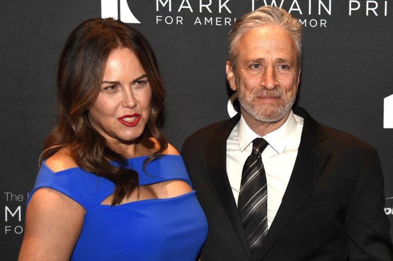 Jon Stewart (R) and wife Tracey McShane pose for photographers as they arrive for The Kennedy Center's presentation of the annual Mark Twain Prize for American Humor on Sunday. File Photo by Mike Theiler/UPI