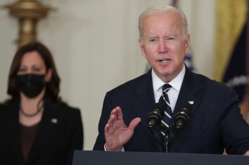 President Joe Biden speaks Thursday while Vice President Kamala Harris listens about his infrastructure bills and compromises on the budget in the East Room of the White House. Photo by Tasos Katopodis/UPI | <a href="/News_Photos/lp/2b821cf99bd144a2664c1f8efb2cf95f/" target="_blank">License Photo</a>