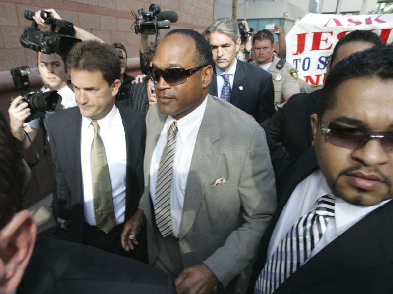 O.J. Simpson (C) and his attorney, Yale Galanter (L), arrive at court for the start of his arraignment hearing in Las Vegas on November 8, 2007. He was arrested September 16, 2007, on 12 charges including eleven felonies ranging from kidnapping and burglary to robbery and assault with a deadly weapon. File Photo by Jae C. Hong/UPI