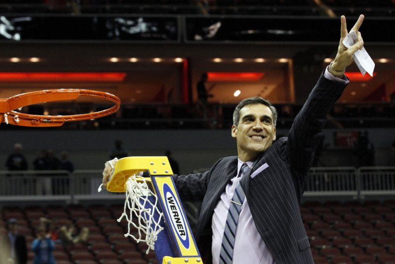 Villanova University head coach Jay Wright celebrates his teams win over the University of Kansas in the South Regional Championship of 2016 NCAA Division I Men's Basketball Championship at the KFC Yum! Center in Louisville, Kentucky, March 26, 2016. Photo by John Sommers II/UPI. | <a href="/News_Photos/lp/1d5c08cc3df527cb2559d568e9c11800/" target="_blank">License Photo</a>