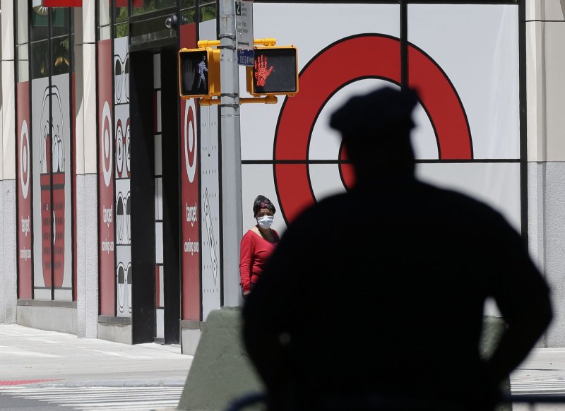 An NYPD Police officer stands by a barricade near a Target retail store as he helps secure the area around Columbus Circle in New York City on Friday. Photo by John Angelillo/UPI | <a href="/News_Photos/lp/db72fda1a795ef04c23ffcd3737d1380/" target="_blank">License Photo</a>
