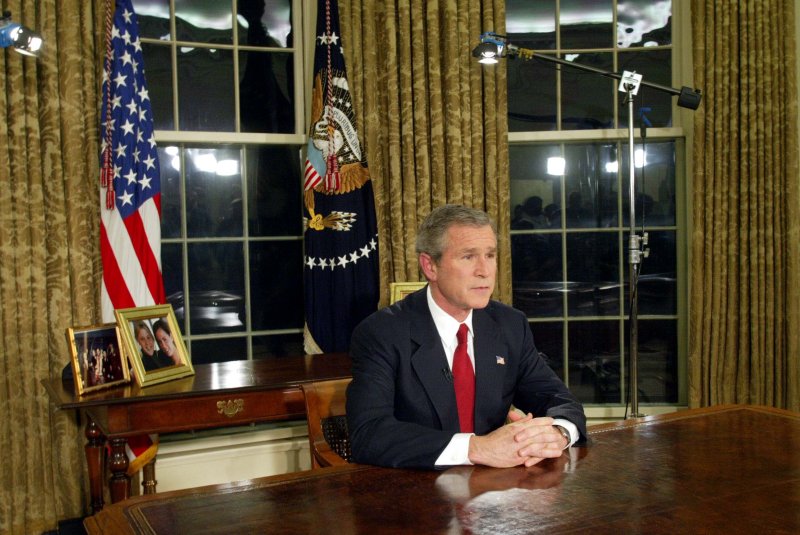 President George W. Bush speaks to the world from the Oval Office of the White House on March 19, 2003, announcing the start of the war against Saddam Hussein in Iraq. UPI File Pool Photo