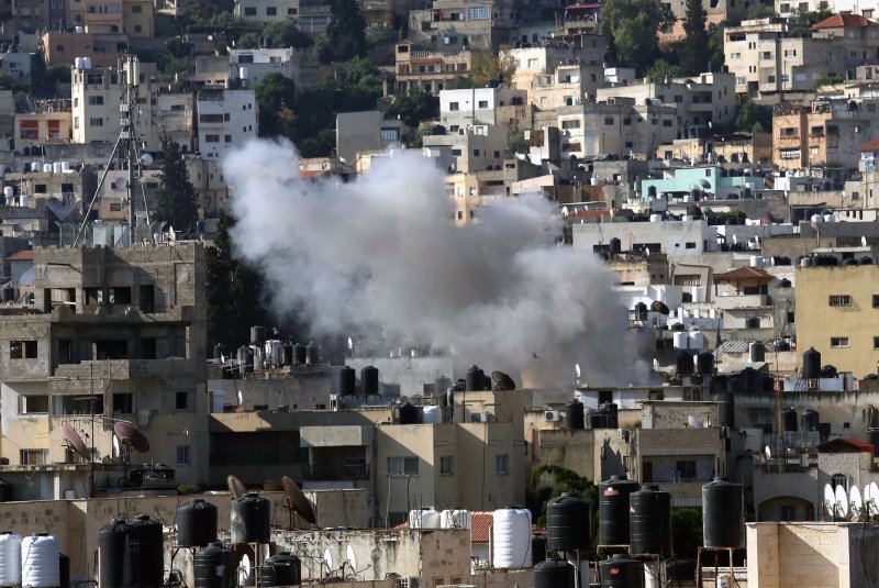 Smoke rises after an Israeli airstrike on Jenin refugee camp in the occupied West Bank on Monday. UPI Photo