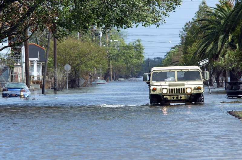 A military vehicle makes it's way down a flooded St. Bernard Street in Louisiana on September 25, 2005, after the region swapped by Hurricane Rita. The storm made landfall on September 24, 2005. File Photo by A.J. Sisco/UPI