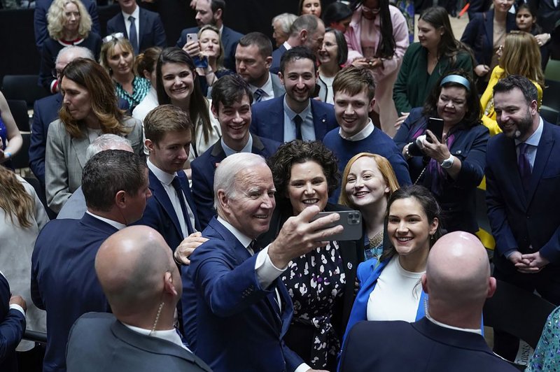 U.S. President Joe Biden takes a selfie with guests after his speech at Ulster University in Belfast, Northern Ireland, on Wednesday. Photo courtesy of U.S. Embassy London/UPI