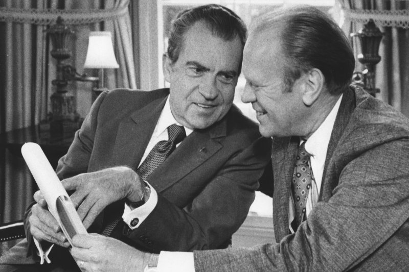 President Richard Nixon briefs then-House Minority Leader Gerald Ford at the White House on October 13, 1973. On November 17, 1973, Nixon uttered the infamous words, "I am not a crook," in response to reporters' questions about the Watergate scandal. UPI File Photo