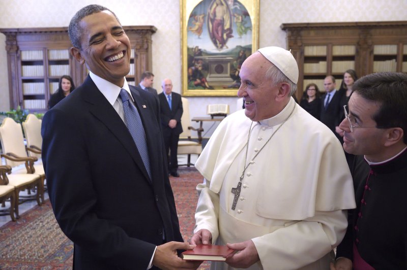 U.S. President Barack Obama exchange gifts as he meets with Pope Francis at a private audience at the Vatican on March 27, 2014. In the nearly hour-long meeting, Obama expressed his admiration for the Pope and invited him to the White House. UPI/Stefano Spaziani
