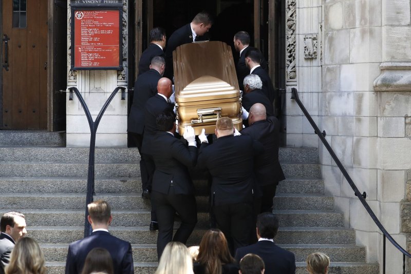 The coffin of Ivana Trump, first wife of Former President Donald Trump, is carried into St. Vincent Ferrer Roman Catholic Church for her funeral on Lexington Avenue in New York City on Wednesday. Photo by Peter Foley/UPI | <a href="/News_Photos/lp/fca5f5a14c13901f2ab68676c92b0bca/" target="_blank">License Photo</a>