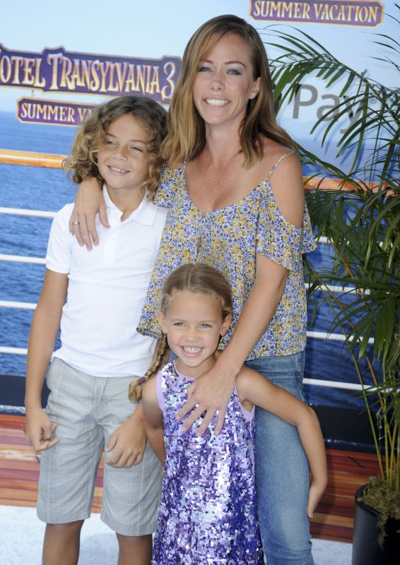 Kendra Wilkinson (R), pictured with son Hank and daughter Alijah, legally ended her marriage to Hank Baskett. File Photo by Patrick Rideaux/UPI