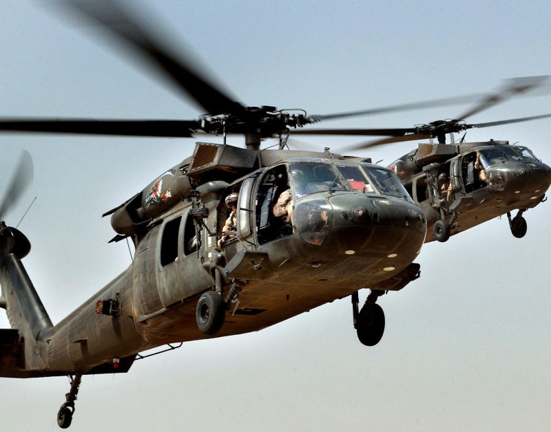 U.S. Army UH-60 Black Hawk helicopters arrive at Forward Operating Base Dagger, Tikrit, Iraq on August 8, 2006. (UPI Photo/Russell Lee Klika/DOD)