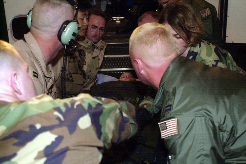 Pfc. Jessica Lynch is put into an ambulance April 3, 2003, at Ramstein Air Base Germany on April 3, 2003. On March 22, 2003, 11 U.S. soldiers were killed and seven, including Lynch, were captured in an ambush on a maintenance convoy in Iraq. File Photo courtesy of the U.S. Air Force