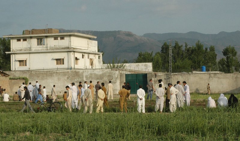 A view of Osama bin Laden's compound in Abbottabad, Pakistan, shows local and international media along with local residents gathered in front of the compound on Thursday, May 5, 2011, after a U.S. military raid late which ended with the death of the al-Qaida leader bin Laden and others inside. UPI/Sajjad Ali Qureshi
