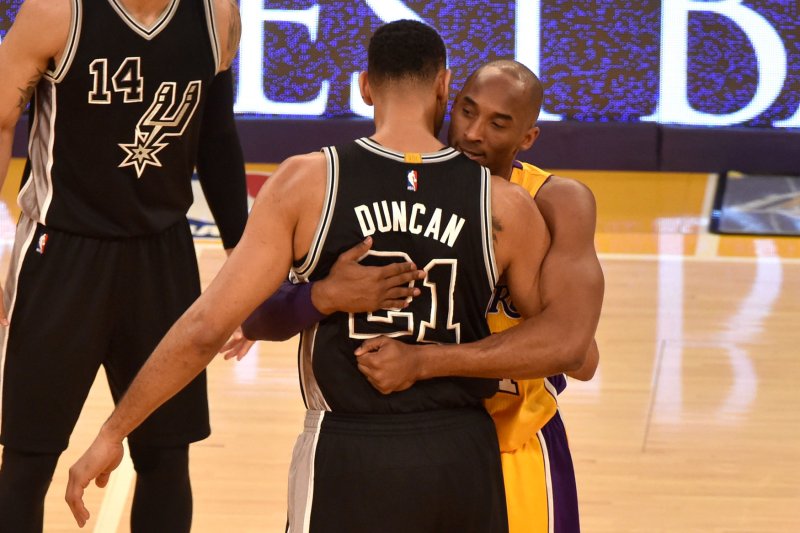 Los Angeles Lakers legend Kobe Bryant (R) hugs San Antonio Spurs great Tim Duncan (L) before a game on Jan. 22, 2016, at Staples Center in Los Angeles. Bryant was an 18-time All-Star and five-time NBA champion with the Lakers. File Photo by Jon SooHoo/UPI | <a href="/News_Photos/lp/d228d6f49f33ff26bf23967fb93b01ec/" target="_blank">License Photo</a>