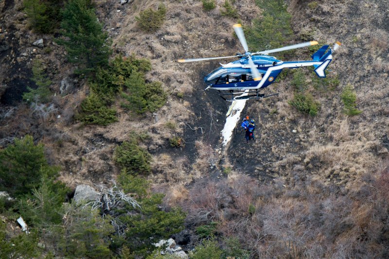 Handout pictures dated 26 March 2015 shows rescue workers at the site where the A320 Lufthansa passenger aircraft crashed in a mountain range of the French Alps. The plane heading to Dusseldorf from Barcelona with 150 people onboard was allegedly taken down by its co-pilot Andreas Lubitz, there were no survivors. Photo by Fabrice Balsamo/MI DICOM/UPI