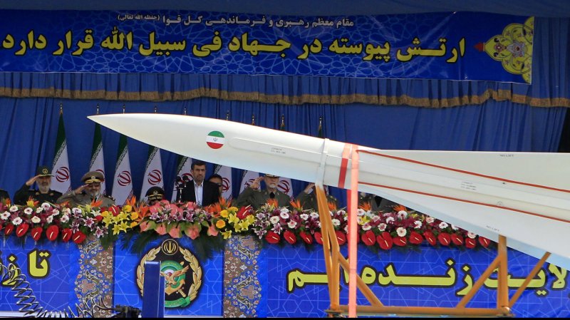 Iranian President Mahmoud Ahmadinejad (C) looks at Iranian-made Sejil missile during Army Day parade at the mausoleum of the founder of the Islamic Republic, the late Ayatollah Ruhollah Khomeini in southern Tehran, Iran on April 18, 2013. A new radar-evading attack drone was revealed. UPI/Maryam Rahmanian