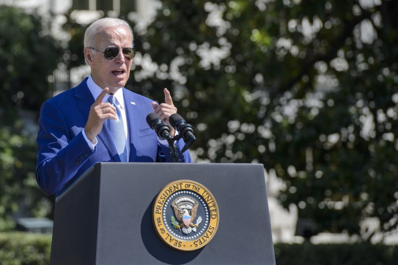 President Joe Biden speaks during a signing ceremony on the South Lawn of the White House in Washington on Tuesday. On Wednesday, he signed a bill that expands healthcare access for veterans who have been exposed to toxic burn pits. Photo by Bonnie Cash/UPI