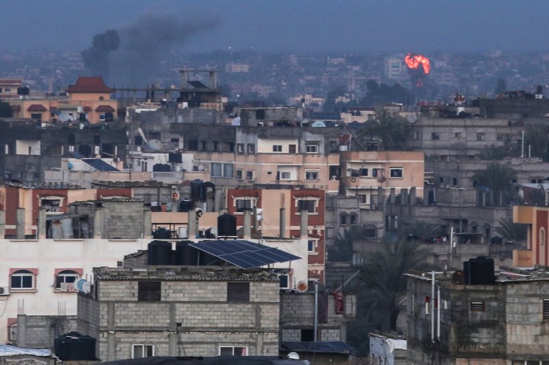 Smoke and fire mark the skyline in Rafah in the southern region of Gaza earlier this month. The Committee to Protect Journalists said 85 media workers have died since fighting started between Israel and Hamas militants on Oct. 7. Photo by Ismael Mohamad/UPI