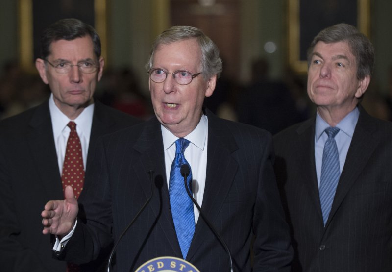 Senate Minority Leader Mitch McConnell (R-KY) speaks to reporters on the extension of unemployment insurance on Capitol Hill in Washington, D.C., January 7, 2014. McConnell was joined by Sen. John Barrasso (R-WY) (L) and Sen. Roy Blunt (R-MO). UPI/Kevin Dietsch