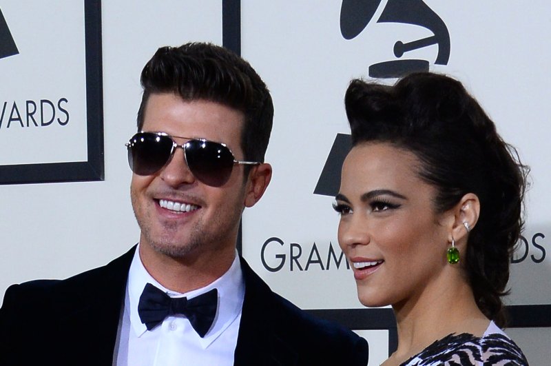 Paula Patton all smiles sans wedding ring, Robin Thicke says he can change