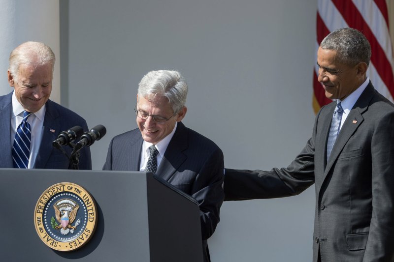 U.S. Supreme Court nominee Merrick Garland (center) smiles after being introduced by President Barack Obama in the Rose Garden of the White House in Washington, D.C., alongside Vice President Joe Biden. Republican presidential candidate Sen. Ted Cruz slammed Obama's nomination of Garland. Photo by Pat Benic/UPI