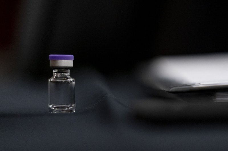 A sample vial of the Pfizer COVID-19 vaccine is seen Thursday on a desk before a Senate subcommittee hearing on transporting ​coronavirus vaccines in the United States, on Capitol Hill in Washington, D.C. Photo by Andrew Harnik/UPI/Pool
