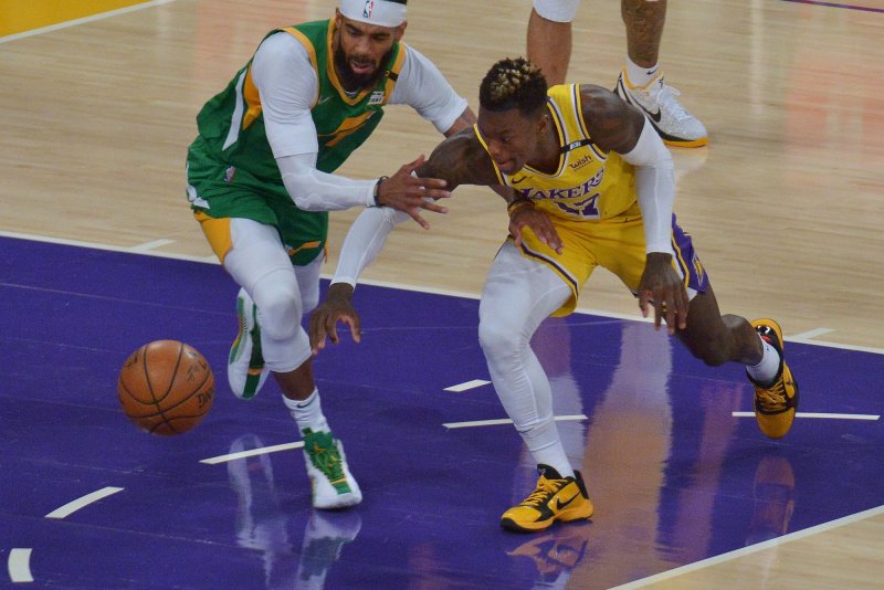 Former Los Angeles Lakers guard Dennis Schroder (R), shown April 19, 2021, turned down a lucrative extension from the Lakers during last season. File Photo by Jim Ruymen/UPI