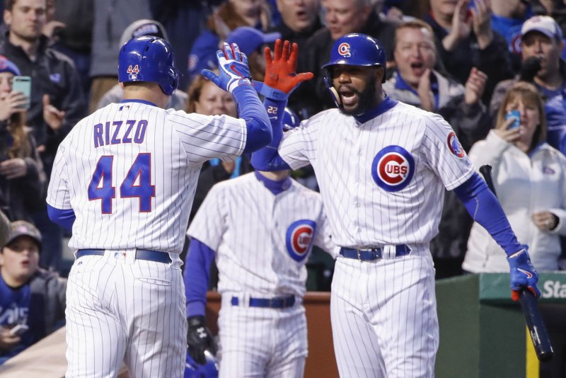 Chicago Cubs Anthony Rizzo (L) celebrates with Jason Heyward (R) after hitting a solo home run off San Francisco Giants starting pitcher Matt Moore in the fourth inning at Wrigley Field on May 24, 2017 in Chicago. File photo by Kamil Krzaczynski/UPI