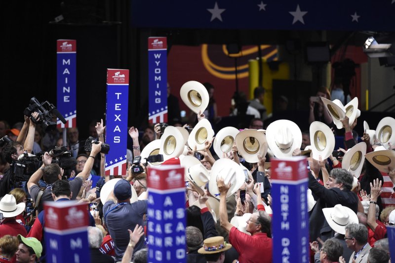 Texas delegates, center, hold stetsons in the air and celebrate as they cast their state's votes for GOP nominee Donald Trump on day two of the Republican National Convention at Quicken Loans Arena in Cleveland, Ohio, on Tuesday. On Wednesday, a federal appeals court ordered that the state of Texas must fix a voter ID registration law enacted three years ago that most of the panel's judges concluded is discriminatory against minority residents and impacts more than 600,000 potential voters. Photo by Pete Marovich/UPI