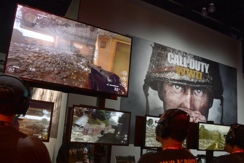 Attendees experience Sony's Call of Duty WW II booth at the E3 Expo in Los Angeles. Britain's antitrust regulator advised Wednesday that Microsoft's proposed take-over of British gaming developer Activision would raise prices and be detrimental to consumer choice and innovation. File photo by Jim Ruymen/UPI