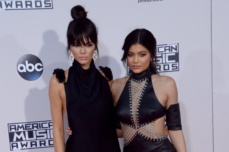 Kendall Jenner (L) and Kylie Jenner attend the American Music Awards on November 22, 2015. The sisters enjoyed an outing with Caitlyn Jenner this week following the star's fallout with their mom, Kris Jenner. File Photo by Jim Ruymen/UPI