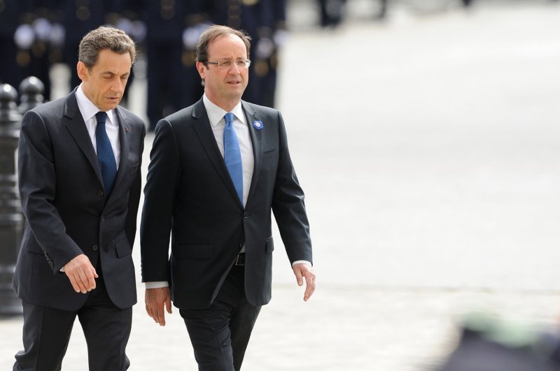 Then-French president-elect Francois Hollande (R) and outgoing President Nicolas Sarkozy attend a ceremony marking the 67th anniversary of the Allied victory over Nazi Germany in World War II at the Arc de Triomphe in Paris, France, on May 8, 2012. Sarkozy announced Monday that he will run to retake the presidency from Hollande in April's presidential election. UPI Photo/Pool