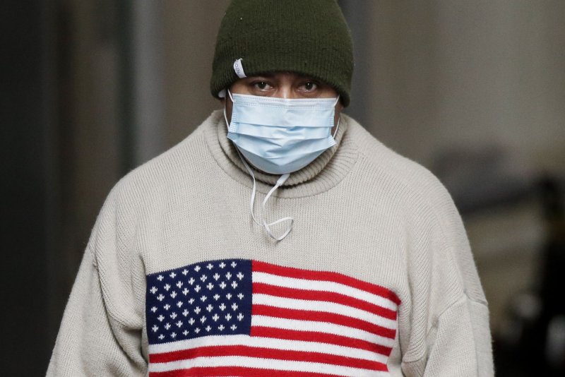 Health experts are now suggesting that people wearing a cloth face mask consider adding a second medical mask underneath it -- referred to as "double-masking" -- to increase the efficacy of the varied forms of face coverings Americans are wearing to prevent spread of COVID-19. File Photo by John Angelillo/UPI